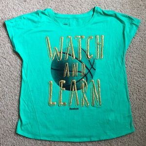 Reebok “Watch and Learn” basketball tee